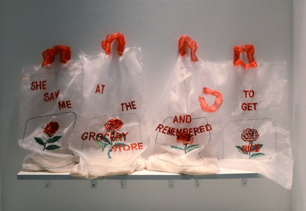 4 rice clear rice bags with red handles, with embroidery on them, red words that say, she saw me at the grocery store and remembered to get rice 