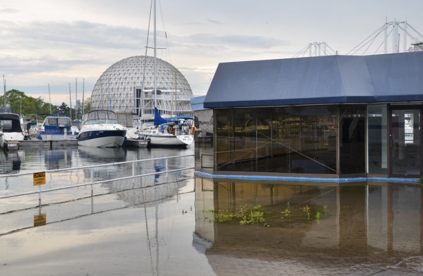flooding at Ontario Place, empty building surrounded by water, boats, cinesphere dome