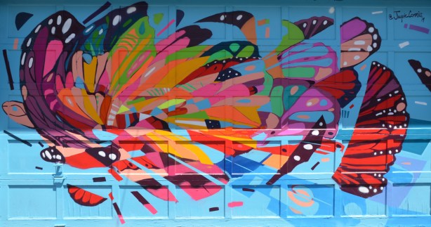 painted mural in a lane, butterfly, very abstract, by Jacquie Comrie