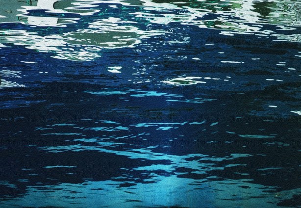abstract in blues, made by close up of reflections and ripples in the water 