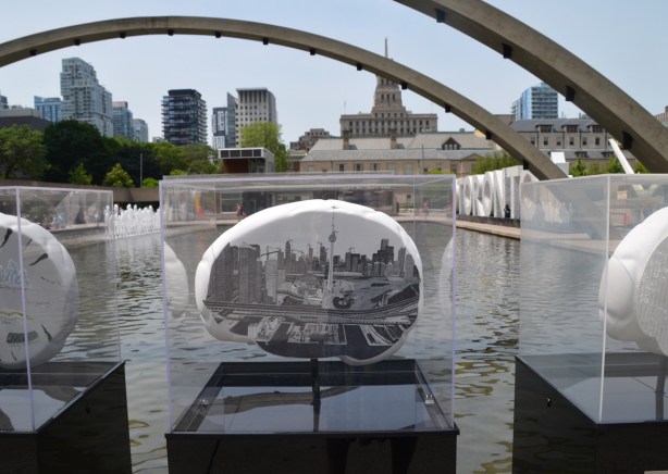 a brain shaped 2 dimensional sculpture, covered with realistic, detailed, drawing of Toronto railway lands with CN tower by Brad Emsley