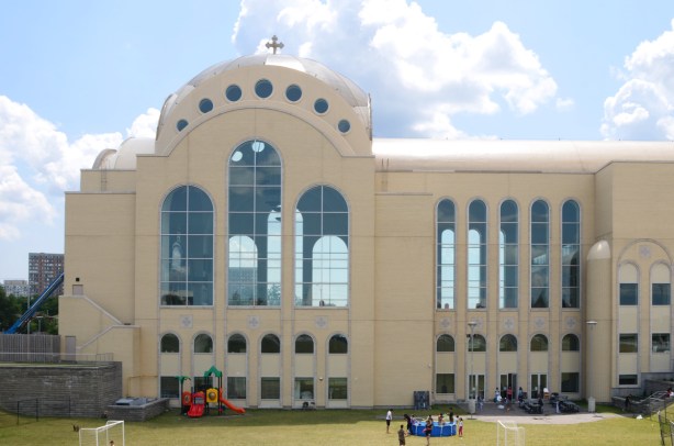 side view of very large pale brown cathedral church, St. Marks Coptic Church, new building, 