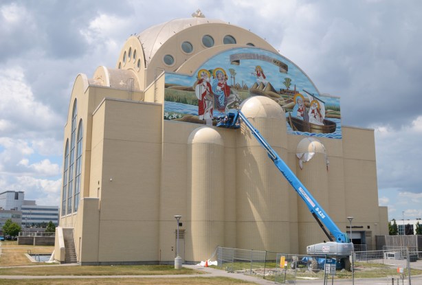 working on mosaic mural, very large pale brown cathedral church, St. Marks Coptic Church, new building, 