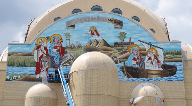 mosaic mural across the top end of very large pale brown cathedral church, St. Marks Coptic Church, new building, 