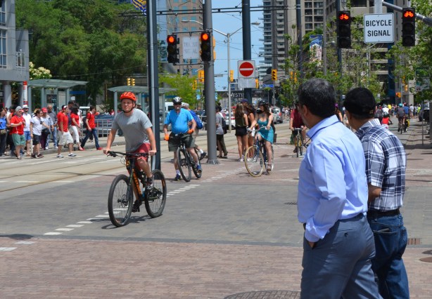 cyclists and pedestrians on Queens Quay 