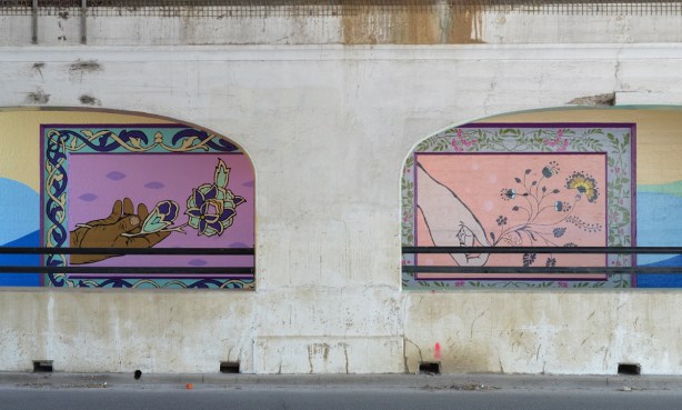 railway underpass street art, seen throughthe supporting concrete arches, paintings of hands holding flowers, framed