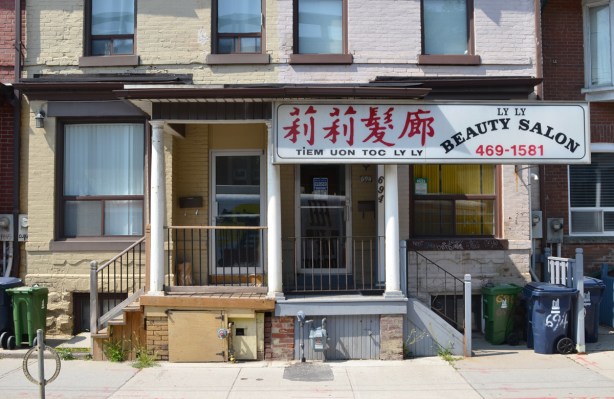 older houses turned into businesses on the ground floor, two semis with Chinese businesses, one is Ly Ly beauty salon