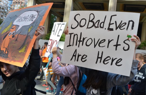 people at Toronto climate strike, walking along Wellesley street with signs, so bad the introverts are here