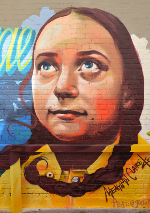 mural in an alley, large portrait of Greta Thunberg, the Swedish teenager advocating for action on climate change, painted by Meaghan Claire Kehoe