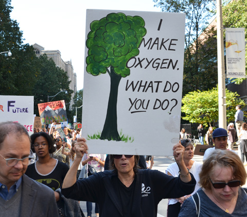people at Toronto climate strike, walking along Wellesley street with signs, I make oxygen what do you do?