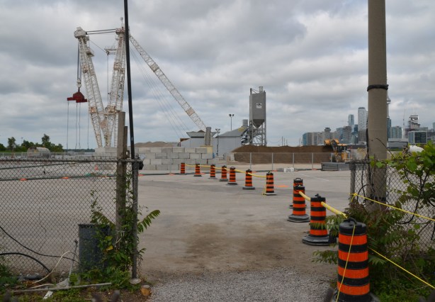 black and orange cones line the route of entry to cement making facility in the Port lands 