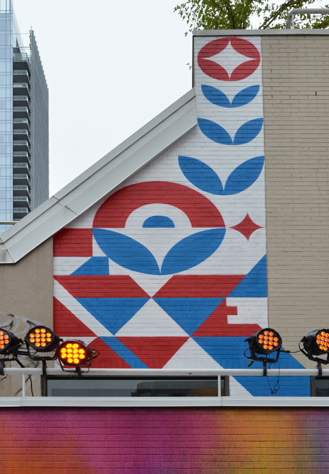 small mural by street artist peru that says love in very stylized and abstract letters