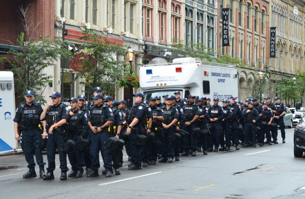 member of p s u , public service unit, wait on Front Street in case they are needed at protest 