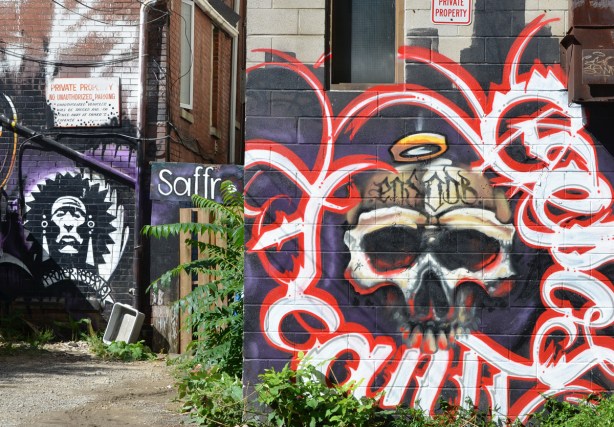 mual in alley with skull with gold halo