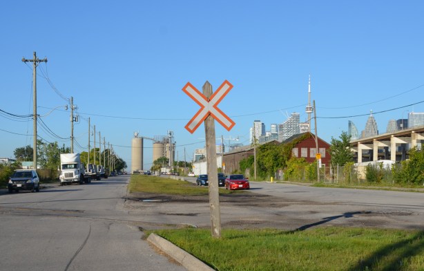 railway crossing sign on Villiers Street in the PortLands, some remnants of train track still there bu no trains 