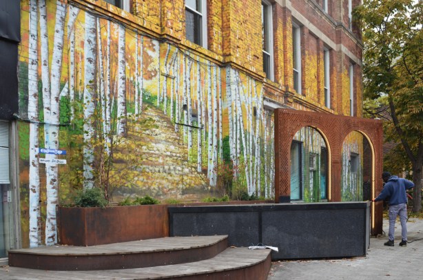 mural by Jim Bravo of a path through a birch forest in autumn