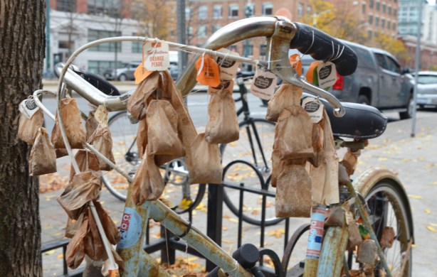 close up of bike decorated with many used tea bags