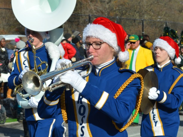 Santa Claus Parade musician, wearing red and white Santa Claus hat