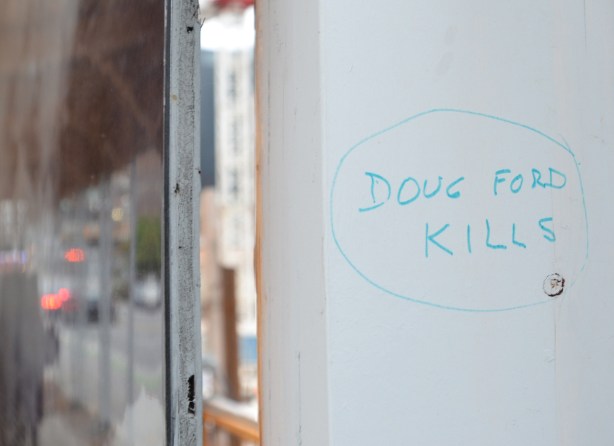 in blue marker, graffiti that says Doug Ford kills