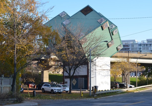 1 Sumach Street, a building made of three green cubes on point on a white pedestal, 3 apartments. 