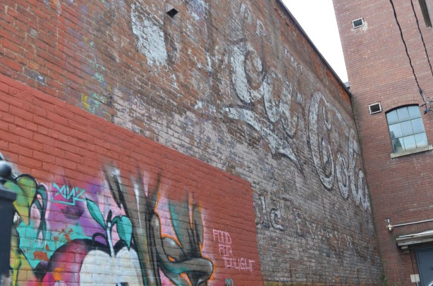 large ghost sign on a brick wall, coca cola sold everywhere, Bathurst Street