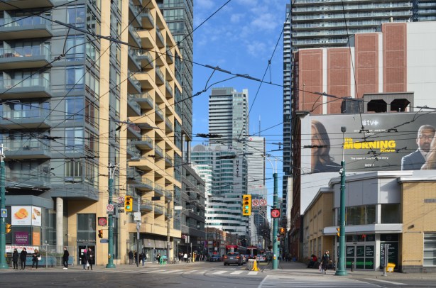 looking eastward along King St from Spadina, high rises, billboard, traffic, city, 