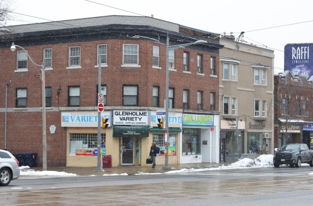 southwest corner of Glenholme and St. Clair with large 3 storey brick building housing GLenholme Variery store and a laundromat.