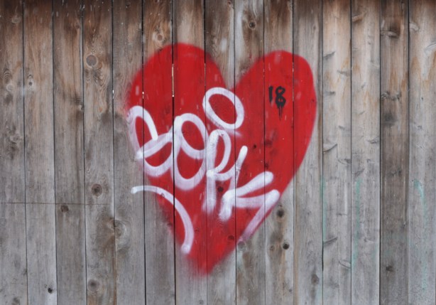 graffiti, red heart on a wood fence