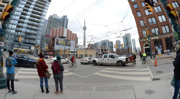 two young women standing on the corner of King & Spadina 