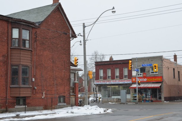 house and stores on Dufferin street, including the San Antonio Coin laundromat and a Home hardware