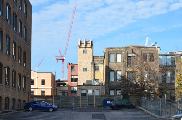 backs of buildings as seen through a parking lot on Wellington street 