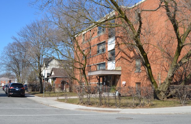 4 storey apartment building, brick, on a corner