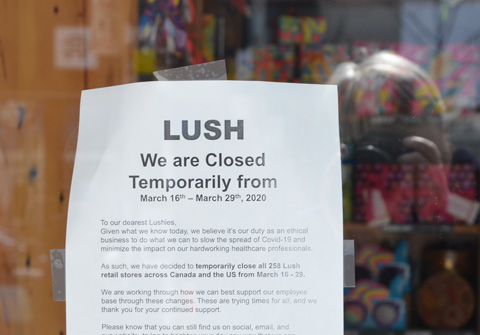 poster sign on door of Lush store explaining why they are closing