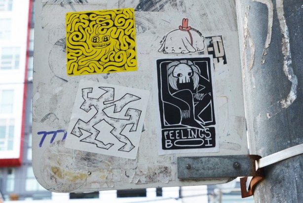 4 stickers graffiti on the back of a street sign, a yellow forge fury wiggly line sticker, a black feelings boi with white line drawing, a small white dog by sketchnate 