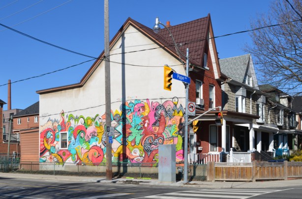 mural by J. CHiale on the side of a house 