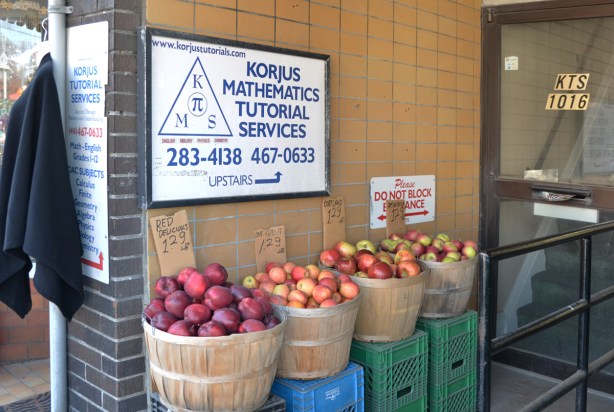 4 bushel baskets of apples in a doorway of the Korjus Mathematics Tutorial Services 