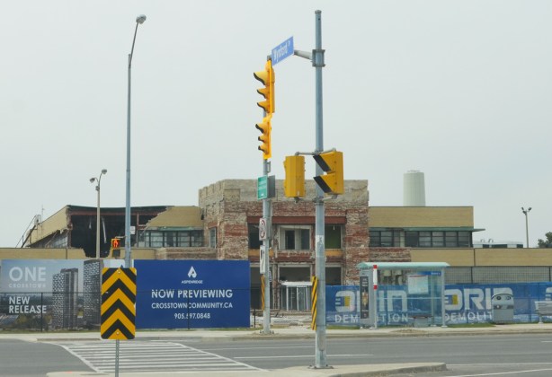 corner of Don Mills and Eglinton during Crosstown construction, IBM building in the background