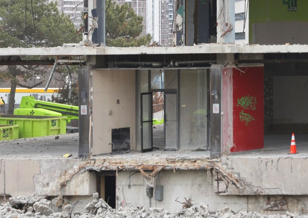 lower levels of a building that has been partially demolished, all the exterior walls have been removed, leaving just the interior walls 