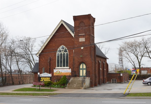 exterior of Fairbank United Church, red stone church, on Dufferin Ave 