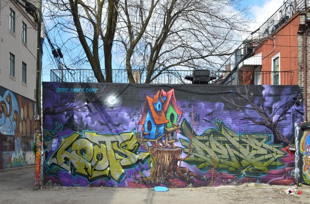 large mural by globe, smoky, and done of a bird house on purple background with green tag text 