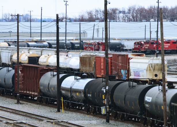 boxcars and tankers waiting on tracks at the CPR yard 