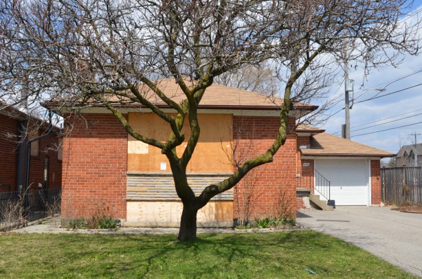 house, bungalow, boarded up and empty, for redevelopment 