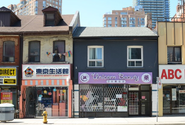 two store fronts on Yonge Street, Unicorn Beauty and a Japanese restaurant 