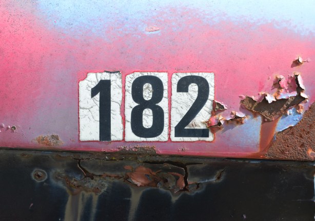 junked, old cars, McLeans Auto Wreckers, on pink and blue old vehicle, the number 182 in old black and white stickers