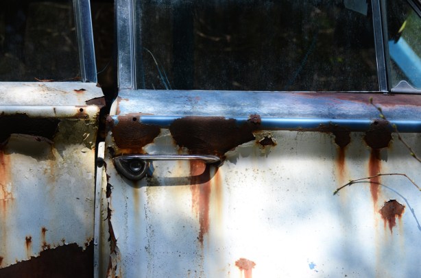 junked, old cars, McLeans Auto Wreckers, door slightly open, rust, handle,