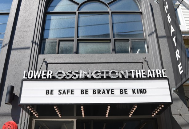 front of Lower Ossington Theatre with marquee that says Be safe Be brave Be kind