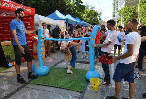 woman doing limbo dancing, pride 