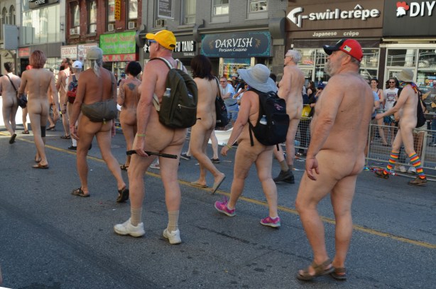 naked people in pride parade, backside view, bums, 