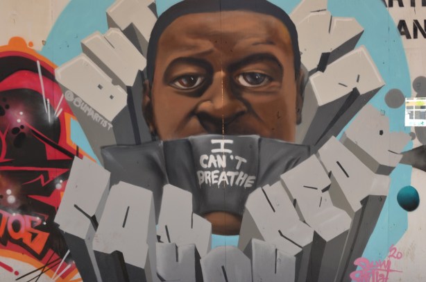 A portrait of George Floyd who was killed by American police in Minneapolis, with lower part of his face covered with a black mask with words I can't breathe written on it.