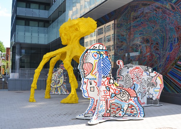 stargate sculpture series, redpath ave in toronto, public art, yellow and blue alien figures and two glass murals